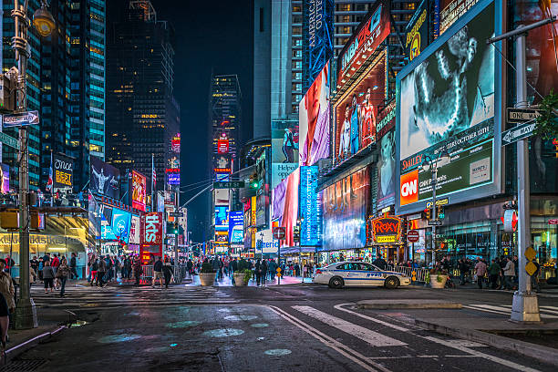 Times Square illuminated at night Times Square illuminated at night